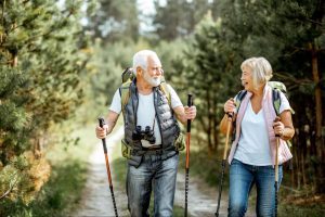 older couple hiking and talking