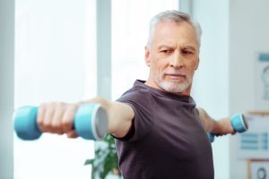 Aging man working out.