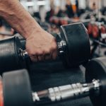 Rows of dumbbells in the gym with hand