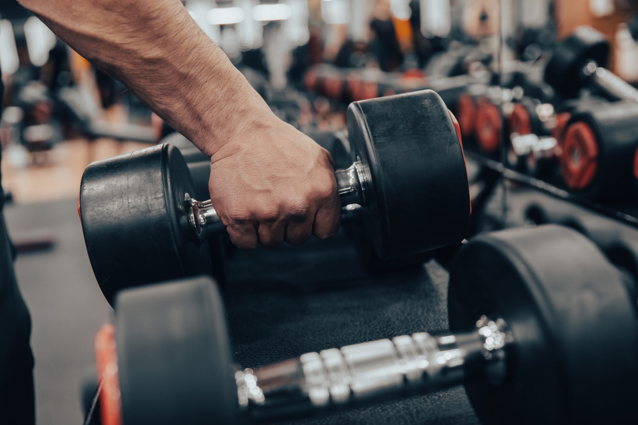 Rows of dumbbells in the gym with hand