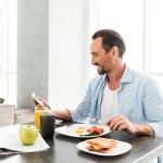 Man eating common foods that lower testosterone