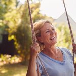Postmenopausal woman on a swing